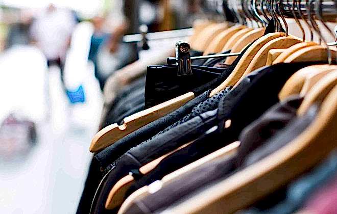 An image of the corner of a clothes rail in a retail park